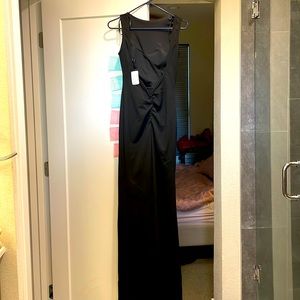 Never worn Windsor tight black gown, open back very elegant.